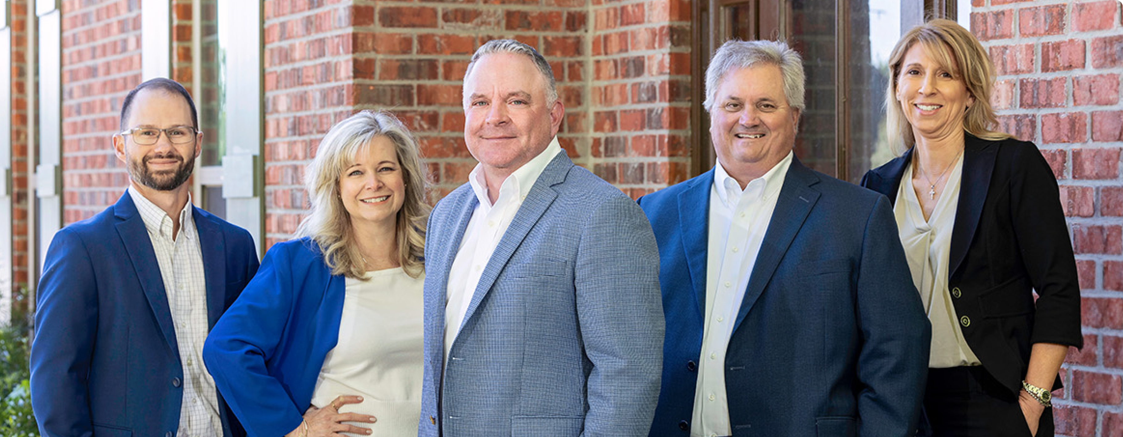 A group of Summit employees with Hughes Insurance President, Bret Hughes.