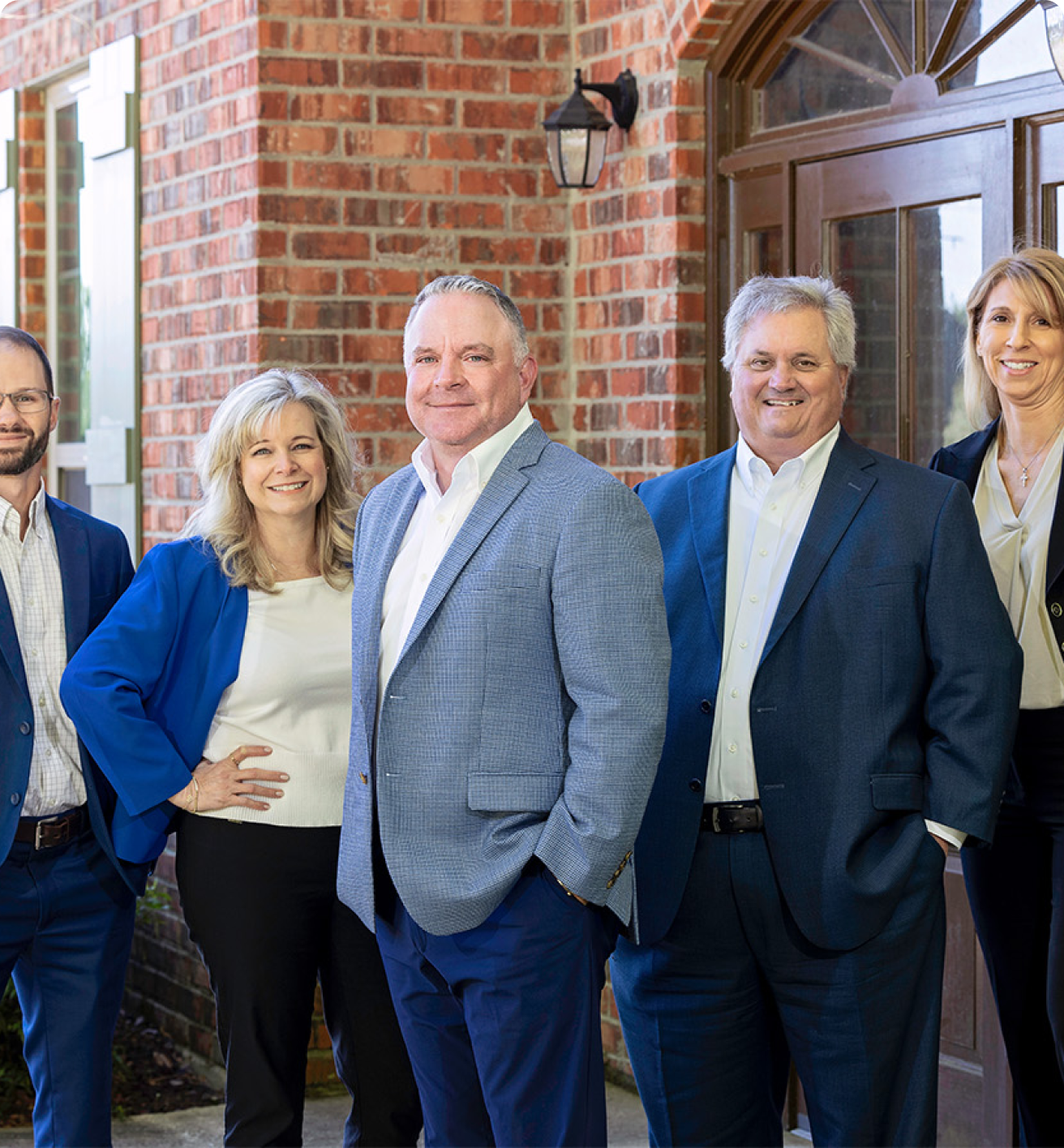 A group of Summit employees with Hughes Insurance President, Bret Hughes.