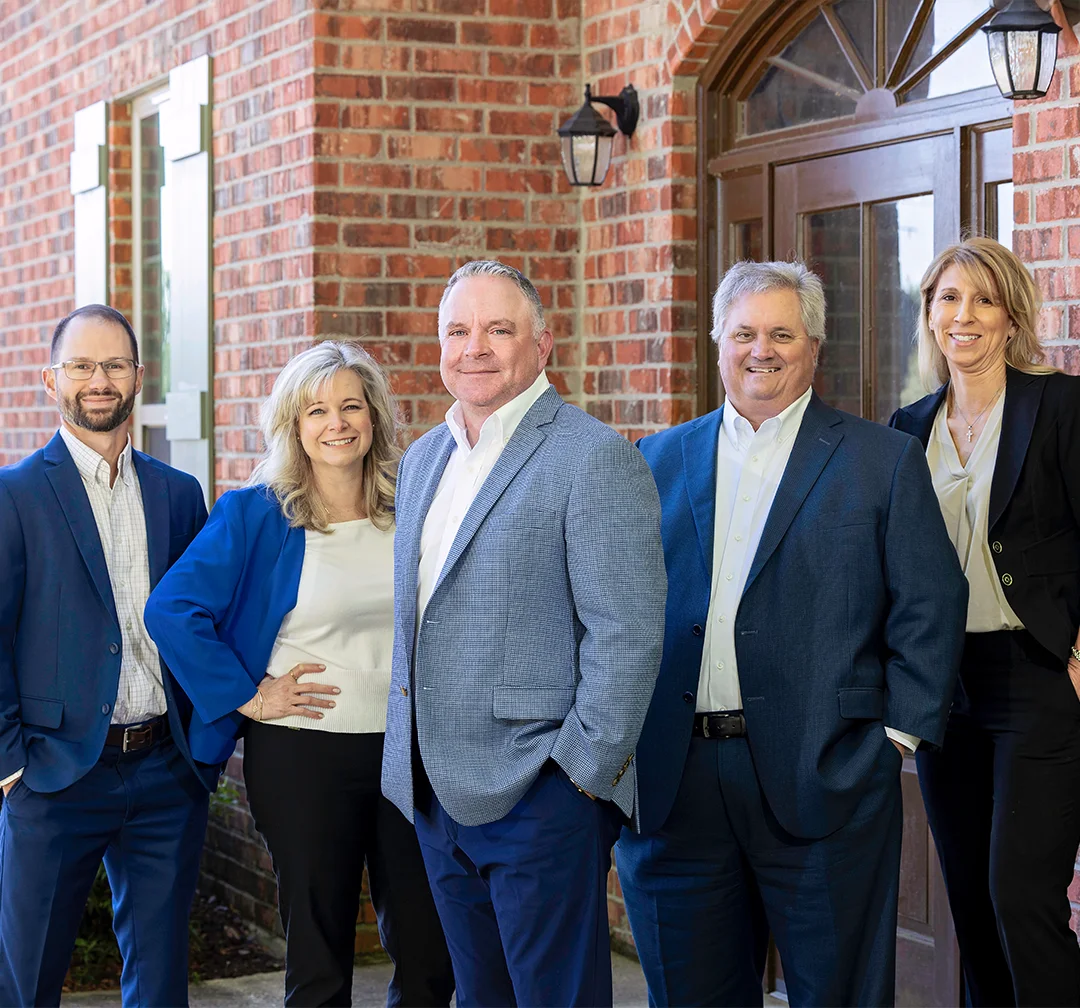 A group of Summit employees with Hughes Insurance president, Bret Hughes.